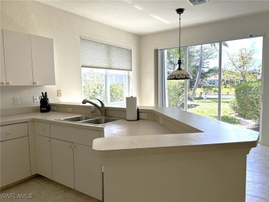 Welcome to this Osprey model home with a fabulous LAKE VIEW on Herons Glen Golf and Country Club in Florida - for sale on GolfHomes.com, golf home, golf lot