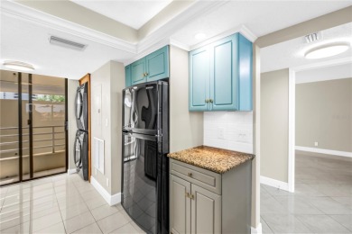 One or more photo(s) has been virtually staged. Coastal Charm - on Pasadena Yacht and Country Club in Florida - for sale on GolfHomes.com, golf home, golf lot