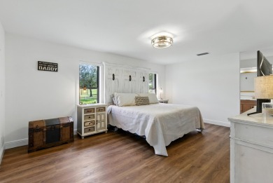 A rare find! 4 bedroom 2.5 bathroom multi-generational living on Indian Spring Golf and Country Club in Florida - for sale on GolfHomes.com, golf home, golf lot