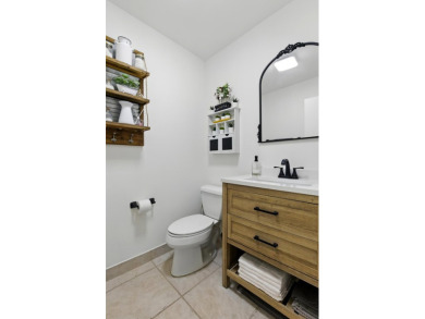 A rare find! 4 bedroom 2.5 bathroom multi-generational living on Indian Spring Golf and Country Club in Florida - for sale on GolfHomes.com, golf home, golf lot