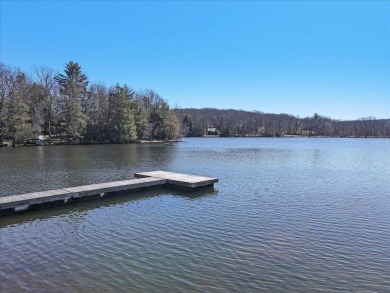 Unbeatable location nestled directly between the tranquil shores on Paupack Hills Golf and Country Club in Pennsylvania - for sale on GolfHomes.com, golf home, golf lot