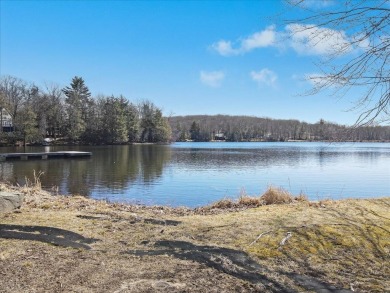 Unbeatable location nestled directly between the tranquil shores on Paupack Hills Golf and Country Club in Pennsylvania - for sale on GolfHomes.com, golf home, golf lot