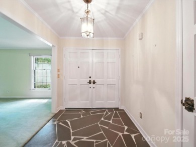Welcome to this 1970s ranch-style home located in the desirable on Pine Island Country Club in North Carolina - for sale on GolfHomes.com, golf home, golf lot