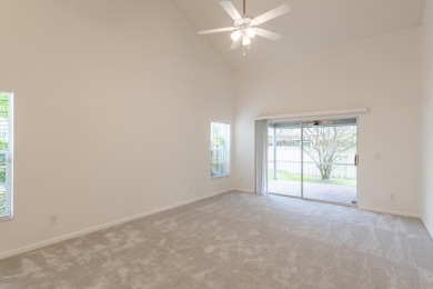 Vaulted ceilings and streaming natural light welcome you into on The Golf Club of Jupiter in Florida - for sale on GolfHomes.com, golf home, golf lot