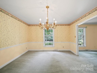 Welcome to this 1970s ranch-style home located in the desirable on Pine Island Country Club in North Carolina - for sale on GolfHomes.com, golf home, golf lot