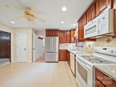 Welcome to this 1970s ranch-style home located in the desirable on Pine Island Country Club in North Carolina - for sale on GolfHomes.com, golf home, golf lot