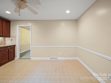Welcome to this 1970s ranch-style home located in the desirable on Pine Island Country Club in North Carolina - for sale on GolfHomes.com, golf home, golf lot
