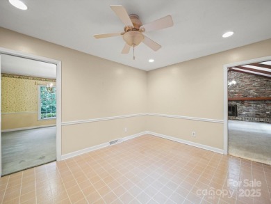 Welcome to this 1970s ranch-style home located in the desirable on Pine Island Country Club in North Carolina - for sale on GolfHomes.com, golf home, golf lot