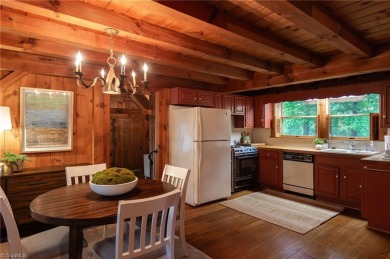 This charming, custom-built, post & beam home is quietly nestled on Sedgefield Golf Course in North Carolina - for sale on GolfHomes.com, golf home, golf lot