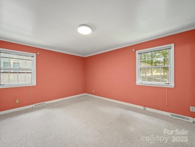 Welcome to this 1970s ranch-style home located in the desirable on Pine Island Country Club in North Carolina - for sale on GolfHomes.com, golf home, golf lot