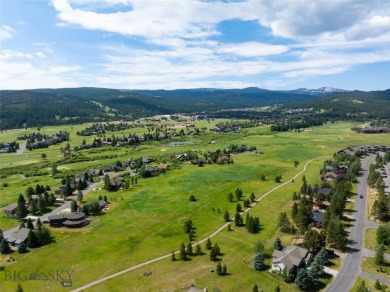 This charming log home, nestled in the trees and perched above on Big Sky of Montana Golf Course in Montana - for sale on GolfHomes.com, golf home, golf lot