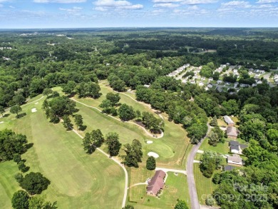 Welcome to this 1970s ranch-style home located in the desirable on Pine Island Country Club in North Carolina - for sale on GolfHomes.com, golf home, golf lot