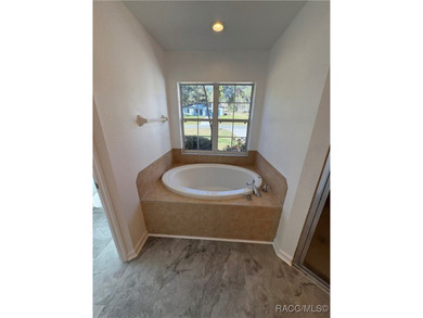 Welcome to this beautifully renovated three bedroom two bath on Citrus Springs Country Club in Florida - for sale on GolfHomes.com, golf home, golf lot