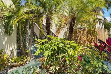 Winding tree-lined roads lead to Sea Grape Villas, where this on Bird Bay Executive Golf Club in Florida - for sale on GolfHomes.com, golf home, golf lot