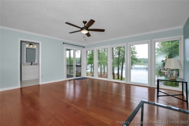 Appraised for $615k. This deceptively large lake front home has on Carolina Trace Country Club in North Carolina - for sale on GolfHomes.com, golf home, golf lot
