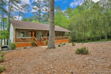 Appraised for $615k. This deceptively large lake front home has on Carolina Trace Country Club in North Carolina - for sale on GolfHomes.com, golf home, golf lot