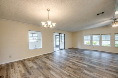 Discover the beauty of Pine Lakes Country Club with this on Pine Lakes Country Club in Florida - for sale on GolfHomes.com, golf home, golf lot