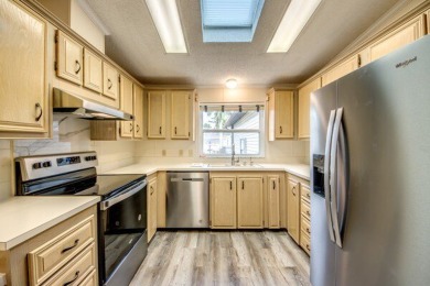 Discover the beauty of Pine Lakes Country Club with this on Pine Lakes Country Club in Florida - for sale on GolfHomes.com, golf home, golf lot
