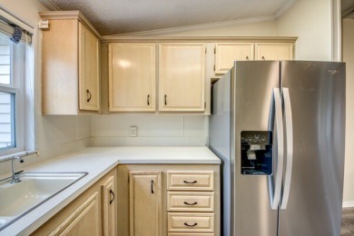 Discover the beauty of Pine Lakes Country Club with this on Pine Lakes Country Club in Florida - for sale on GolfHomes.com, golf home, golf lot