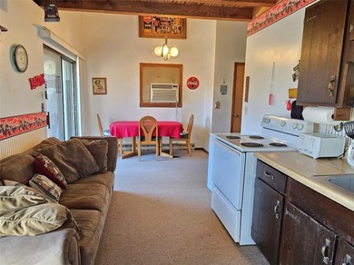 Sugar Valley Lakefront Getaway sits on double lots #79 & #80 on Sugar Valley Lakes Golf Course in Kansas - for sale on GolfHomes.com, golf home, golf lot