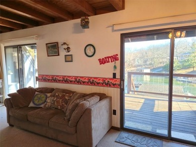 Sugar Valley Lakefront Getaway sits on double lots #79 & #80 on Sugar Valley Lakes Golf Course in Kansas - for sale on GolfHomes.com, golf home, golf lot