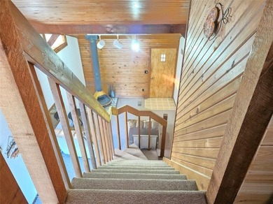 Sugar Valley Lakefront Getaway sits on double lots #79 & #80 on Sugar Valley Lakes Golf Course in Kansas - for sale on GolfHomes.com, golf home, golf lot