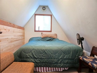 Sugar Valley Lakefront Getaway sits on double lots #79 & #80 on Sugar Valley Lakes Golf Course in Kansas - for sale on GolfHomes.com, golf home, golf lot