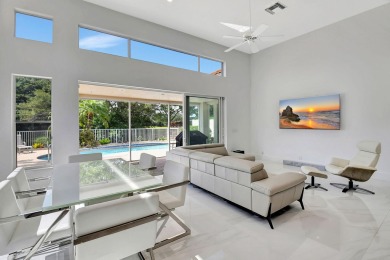 What a spectacular 3 bedroom 4 bath contemporary remodeled home on Broken Sound Golf and Club  in Florida - for sale on GolfHomes.com, golf home, golf lot