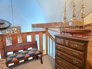 Sugar Valley Lakefront Getaway sits on double lots #79 & #80 on Sugar Valley Lakes Golf Course in Kansas - for sale on GolfHomes.com, golf home, golf lot