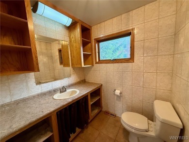 Welcome to this well-maintained 4-bedroom, 2-bath brick Ranch on Seneca Hickory Stick Golf Course in New York - for sale on GolfHomes.com, golf home, golf lot
