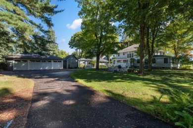 Offering turn-of-the-century charm, this historic Charlevoix on Charlevoix Golf Club in Michigan - for sale on GolfHomes.com, golf home, golf lot