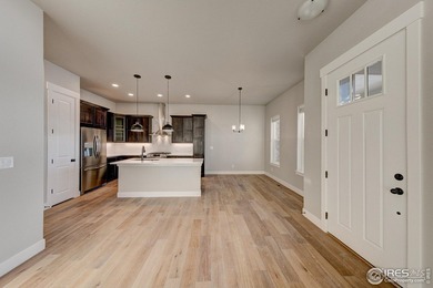 The Duxbury by Landmark Homes offers ranch-style living + a on Highland Meadows Golf Course in Colorado - for sale on GolfHomes.com, golf home, golf lot