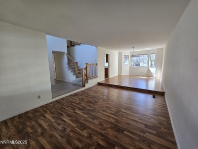 Imagine a charming two-story family home nestled in a serene on LakeRidge Golf Course in Nevada - for sale on GolfHomes.com, golf home, golf lot