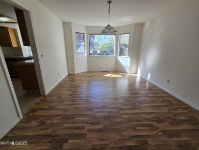 Imagine a charming two-story family home nestled in a serene on LakeRidge Golf Course in Nevada - for sale on GolfHomes.com, golf home, golf lot