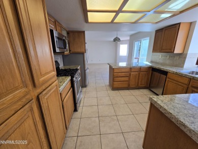 Imagine a charming two-story family home nestled in a serene on LakeRidge Golf Course in Nevada - for sale on GolfHomes.com, golf home, golf lot