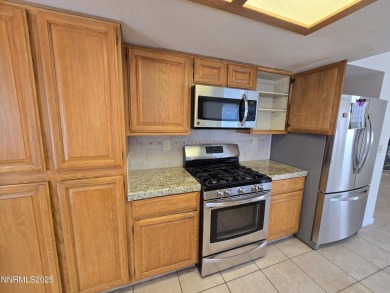 Imagine a charming two-story family home nestled in a serene on LakeRidge Golf Course in Nevada - for sale on GolfHomes.com, golf home, golf lot