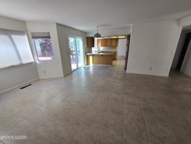 Imagine a charming two-story family home nestled in a serene on LakeRidge Golf Course in Nevada - for sale on GolfHomes.com, golf home, golf lot