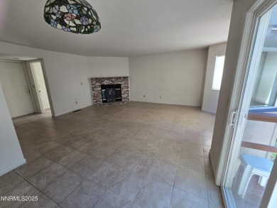 Imagine a charming two-story family home nestled in a serene on LakeRidge Golf Course in Nevada - for sale on GolfHomes.com, golf home, golf lot