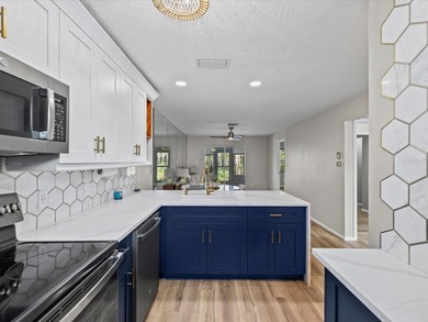 Completely updated, luxurious unit located within the gates of on Seven Springs Golf and Country Club in Florida - for sale on GolfHomes.com, golf home, golf lot