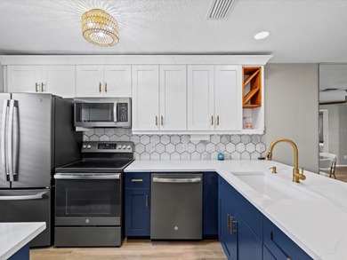 Completely updated, luxurious unit located within the gates of on Seven Springs Golf and Country Club in Florida - for sale on GolfHomes.com, golf home, golf lot