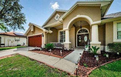 MAJOR PRICE IMPROVEMENT conservation view STUNNER in TARPON on Tarpon Springs Golf Course in Florida - for sale on GolfHomes.com, golf home, golf lot