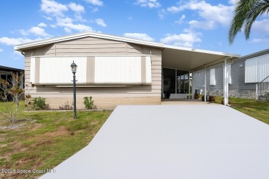 Own this home in the resort like community of Barefoot Bay on Barefoot Bay Golf Course in Florida - for sale on GolfHomes.com, golf home, golf lot