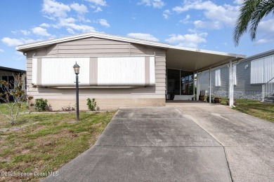 Own this home in the resort like community of Barefoot Bay on Barefoot Bay Golf Course in Florida - for sale on GolfHomes.com, golf home, golf lot