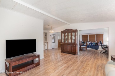 Own this home in the resort like community of Barefoot Bay on Barefoot Bay Golf Course in Florida - for sale on GolfHomes.com, golf home, golf lot