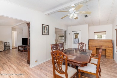 Own this home in the resort like community of Barefoot Bay on Barefoot Bay Golf Course in Florida - for sale on GolfHomes.com, golf home, golf lot