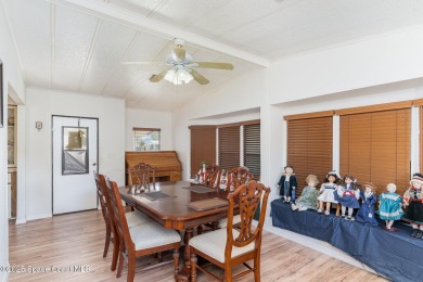 Own this home in the resort like community of Barefoot Bay on Barefoot Bay Golf Course in Florida - for sale on GolfHomes.com, golf home, golf lot