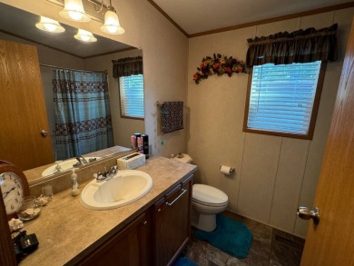 Two-bedroom one bath located on Roy Lake. 2009 14 x 55 mobile on Roy View Golf Course in South Dakota - for sale on GolfHomes.com, golf home, golf lot