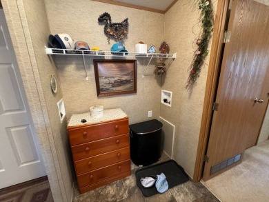 Two-bedroom one bath located on Roy Lake. 2009 14 x 55 mobile on Roy View Golf Course in South Dakota - for sale on GolfHomes.com, golf home, golf lot