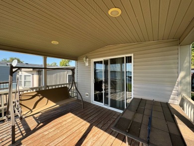 Two-bedroom one bath located on Roy Lake. 2009 14 x 55 mobile on Roy View Golf Course in South Dakota - for sale on GolfHomes.com, golf home, golf lot