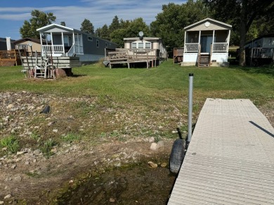 Two-bedroom one bath located on Roy Lake. 2009 14 x 55 mobile on Roy View Golf Course in South Dakota - for sale on GolfHomes.com, golf home, golf lot